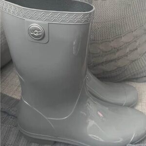 UGG Glossy Gray Boots with fur bottom on inside .